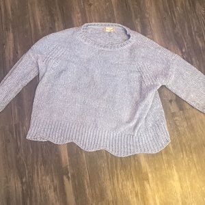 Really soft material. Light blue and white sweater